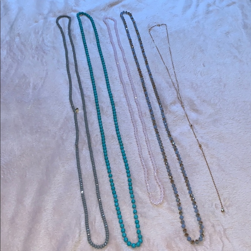 Long beaded necklaces.